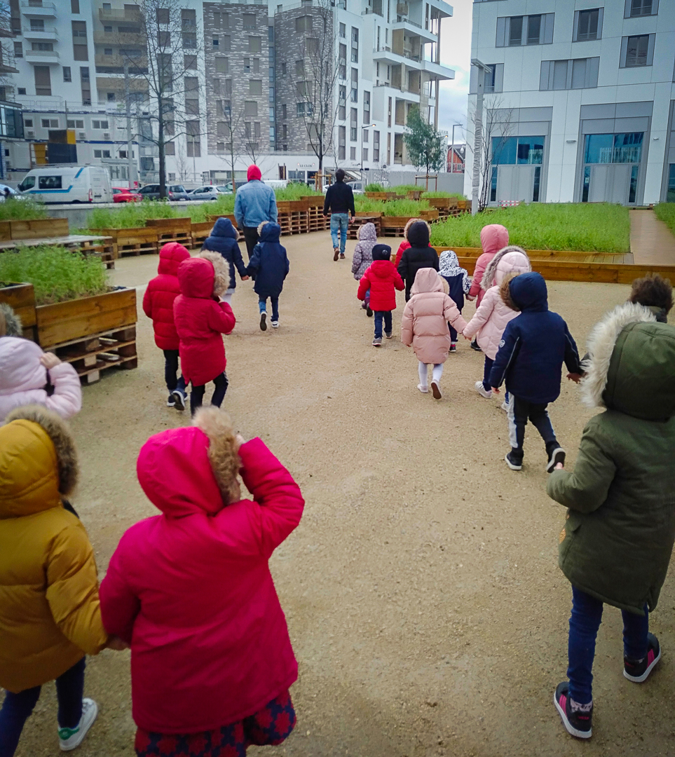 Children from Opaline primary school in the Campus vegetable garden